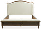 Sturlayne California King Upholstered Panel Bed with Mirrored Dresser and Nightstand
