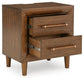 Lyncott California King Upholstered Bed with Mirrored Dresser and Nightstand